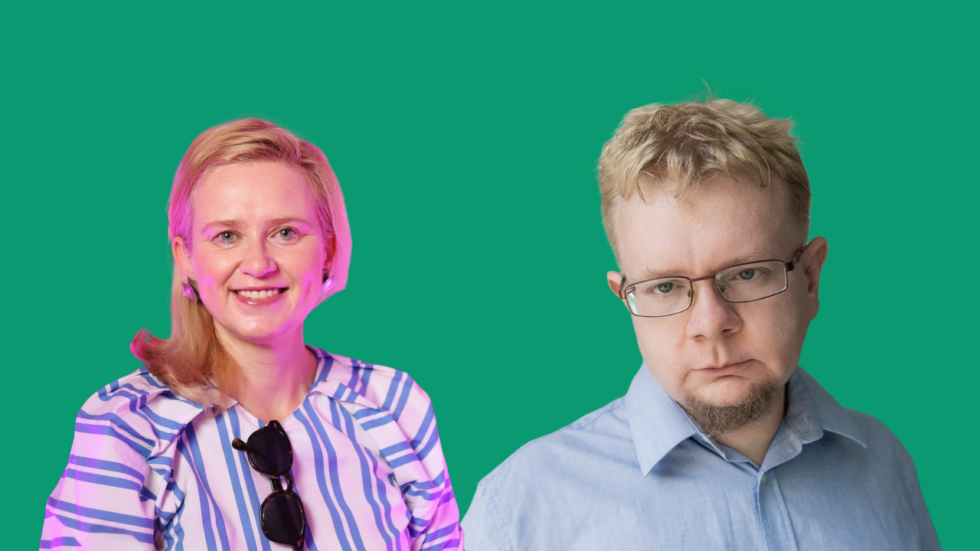 Smiling woman in a striped blouse with sunglasses hanging from her neckline beside a serious man in a blue shirt and glasses against a green backdrop.
