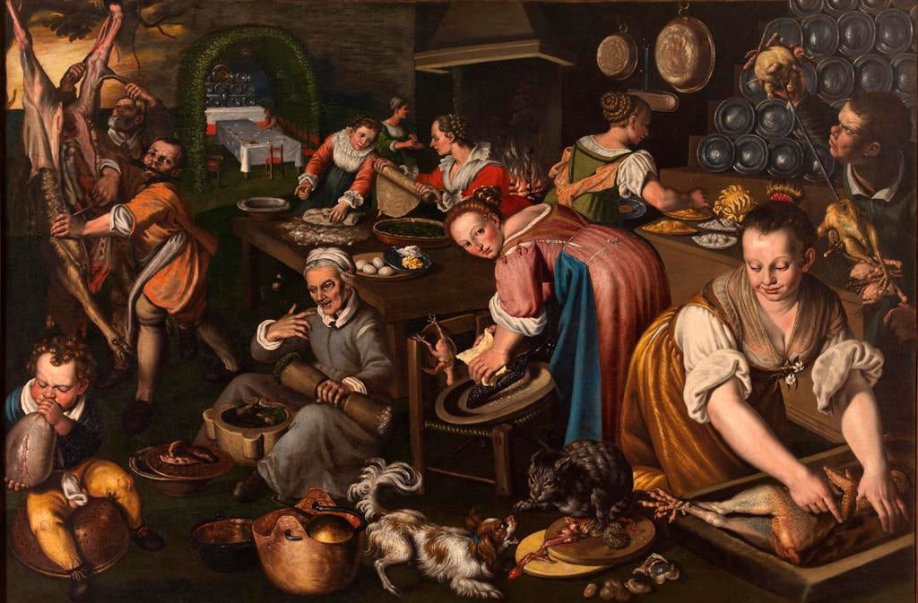 Busy Renaissance kitchen with cooks carving meat, preparing dishes, and tending a hearth around a long table.
