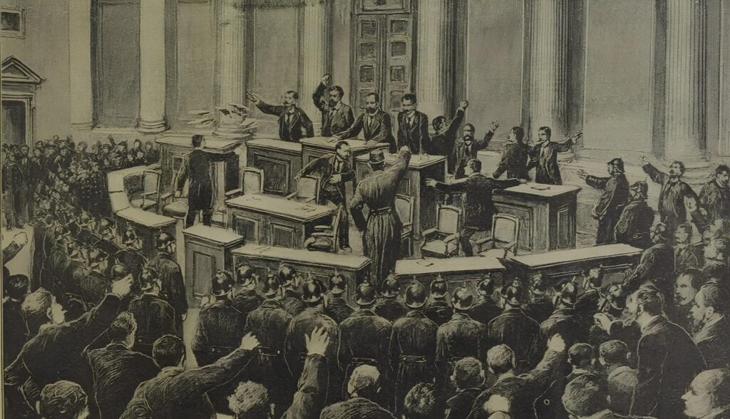 Courtroom scene with judges at a raised bench, lawyers arguing, and a large audience watching.