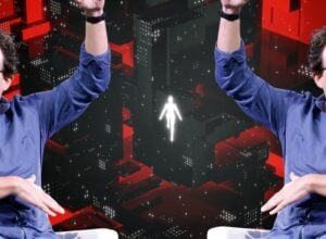 Two identical men in blue shirts and glasses raise their arms in the air against a red, black, geometric digital background with a glowing white humanoid figure in the center.