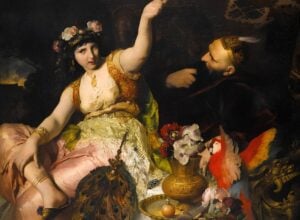 Renaissance-style painting of a regal woman in a gold-embellished dress, with raised arm, facing a bearded man in a crown amid a floral, ornate setting.