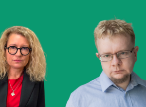 Two adults pose against a solid green background: woman with blonde, curly hair and black glasses on the left, man with blond hair and rectangular glasses on the right.