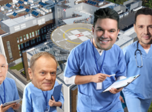 Four doctors in blue scrubs stand on a hospital rooftop near a circular helicopter pad, with the hospital building and solar panels in the background.