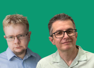 Two men with glasses stand side by side against a green background.