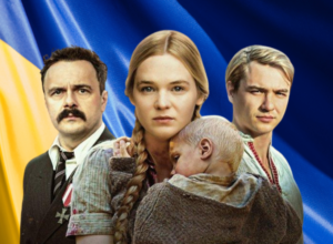 Family of four stands before a blue-yellow Ukrainian flag: stern man in suit, woman with braided hair holding a child, and a blond man beside them