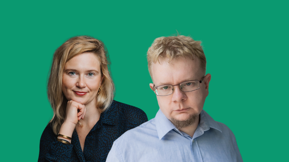 Two colleagues posing together against a green backdrop: woman smiling softly on the left, man with glasses on the right looking at the camera with a neutral expression.