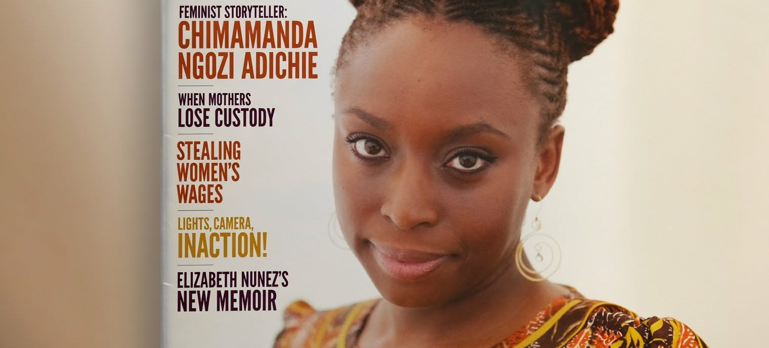 Magazine cover featuring a close-up portrait of Chimamanda Ngozi Adichie on the right with bold left-aligned headlines about feminism and memoirs on the left.