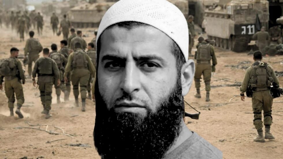 Close-up of a bearded man wearing a white cap, overlaid on a desert battlefield with soldiers walking in the background.