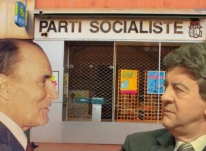 Two men in business suits face each other outside a storefront with a 'Parti Socialiste' sign above the door