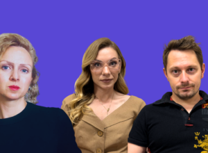 Group portrait of three adults standing against a solid purple background: a curly-haired woman on the left, a woman with glasses in the center, and a man on the right.