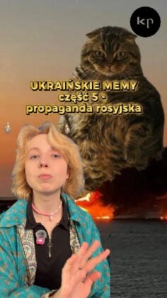 Meme image: a woman in a turquoise jacket in the foreground with a large cat image and Polish caption about Ukrainian memes and Russian propaganda in the background.