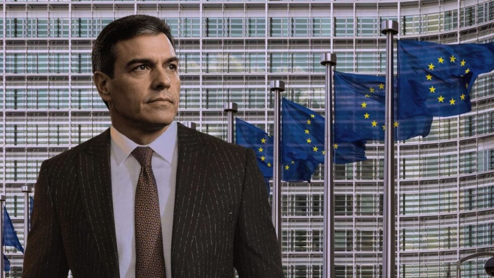 Pedro Sanchez na tle budynku i flag UE