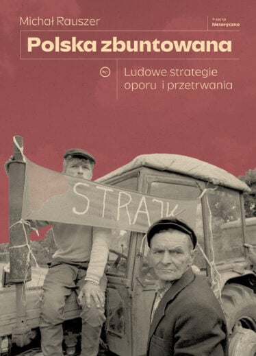 Two men on a truck during a historical strike, holding a banner that reads 'STRAJK'.