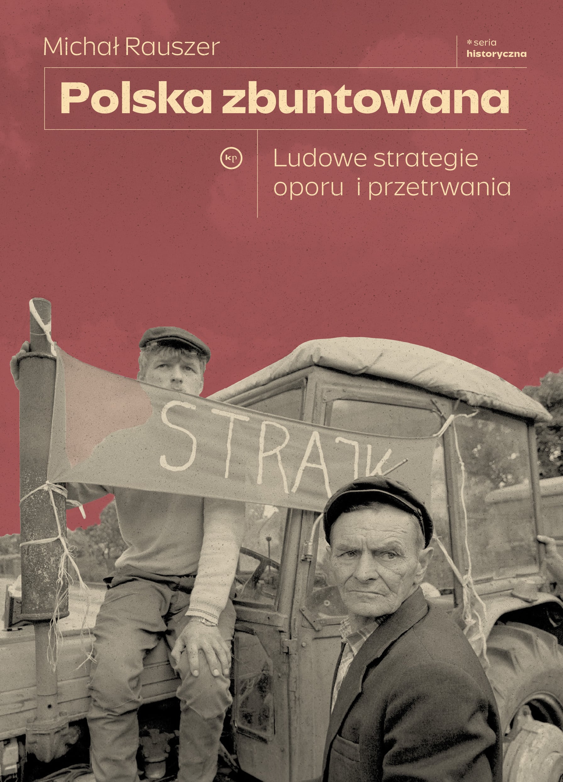 Two men on a truck during a historical strike, holding a banner that reads 'STRAJK'.